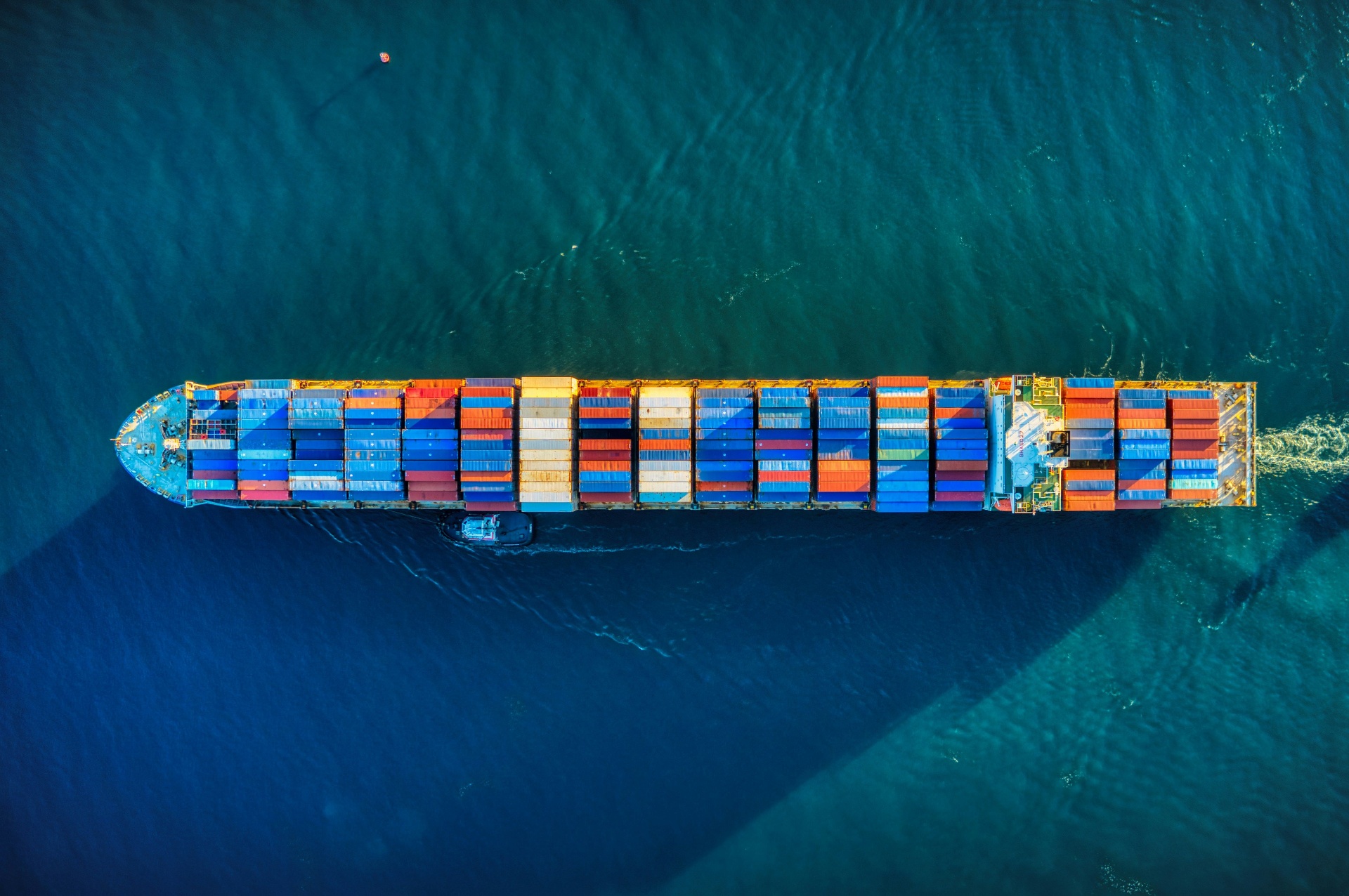 Container ship with colorful cargo containers viewed from above